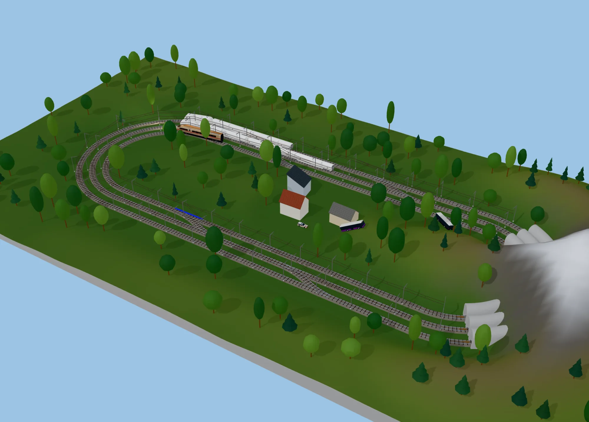 A triple-track H0 oval in the mountains
