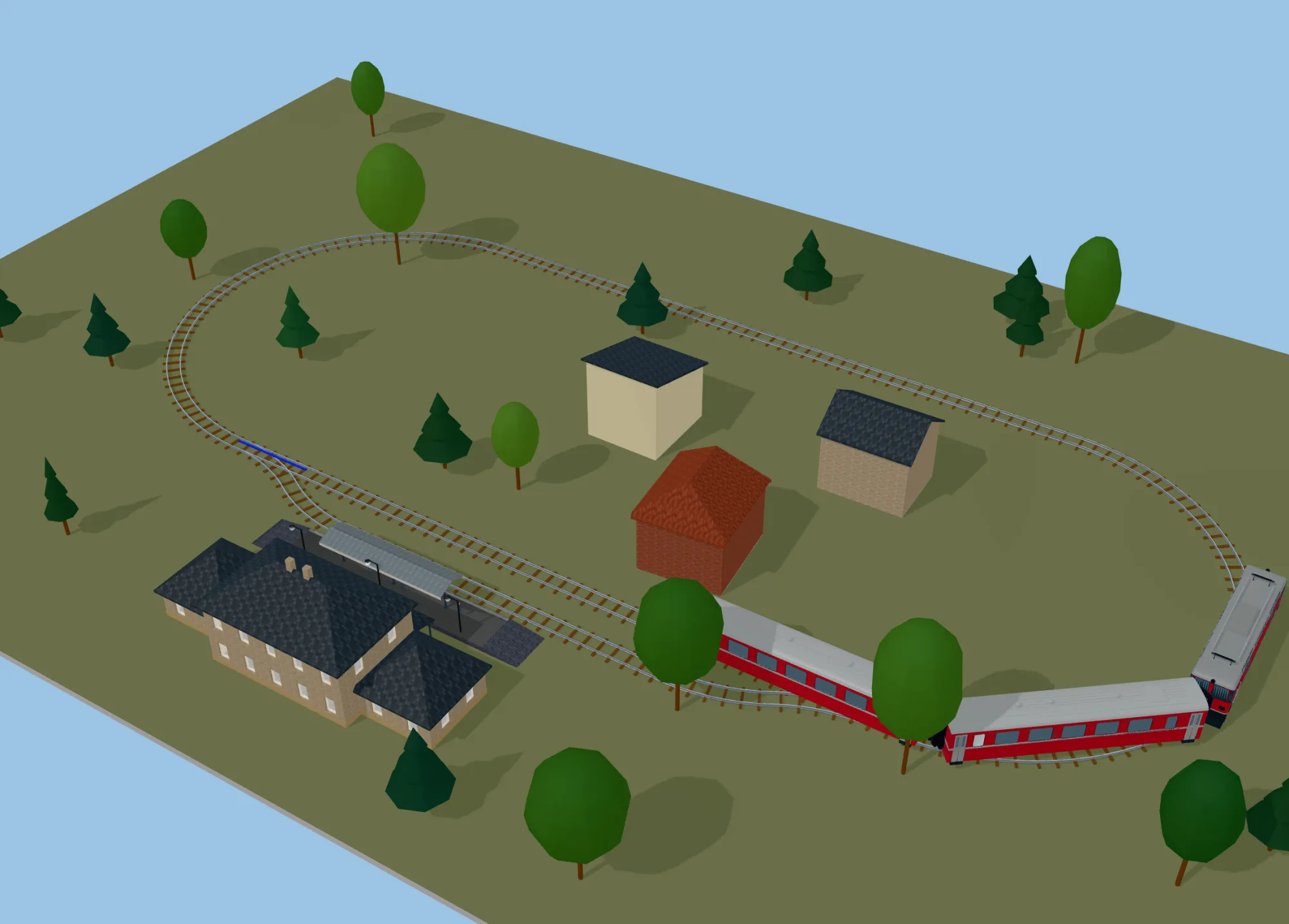 The same LGB oval with a station, houses and a train